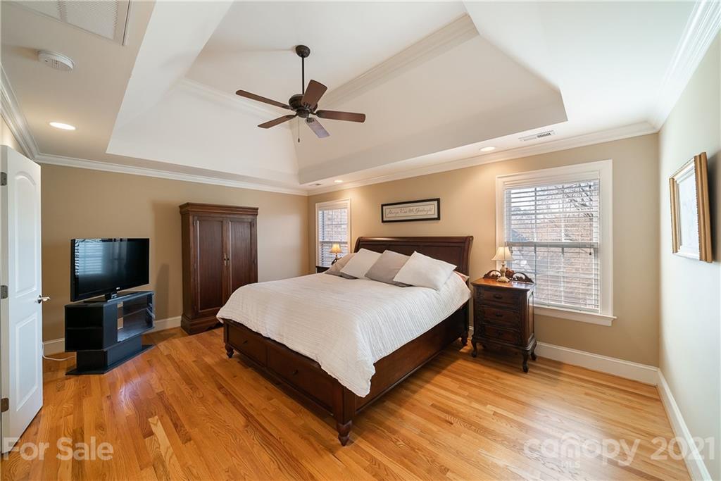268 Hemmingway Lane Fort Mill, SC 29708 - Photo 26 of 43 a bedroom with a bed and wooden floor