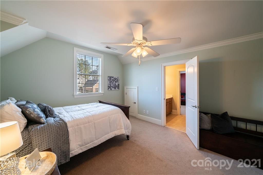 268 Hemmingway Lane Fort Mill, SC 29708 - Photo 31 of 43 a bedroom with a bed and a chandelier
