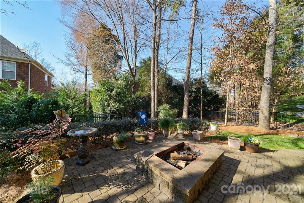 268 Hemmingway Lane Fort Mill, SC 29708 - Photo 40 of 43 a view of a patio with couches and table and chairs and potted plants