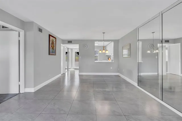 a view of empty room with a fireplace