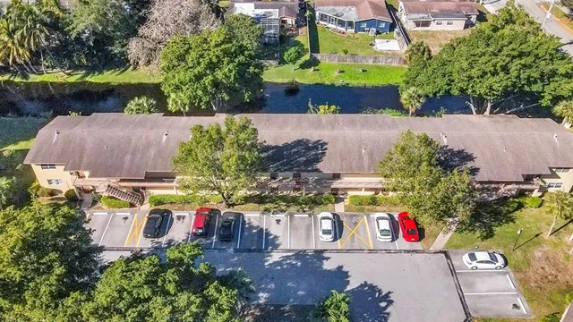 an aerial view of a house with a yard and garden