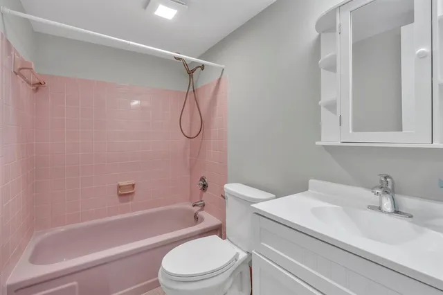 a bathroom with a sink a toilet and a bathtub