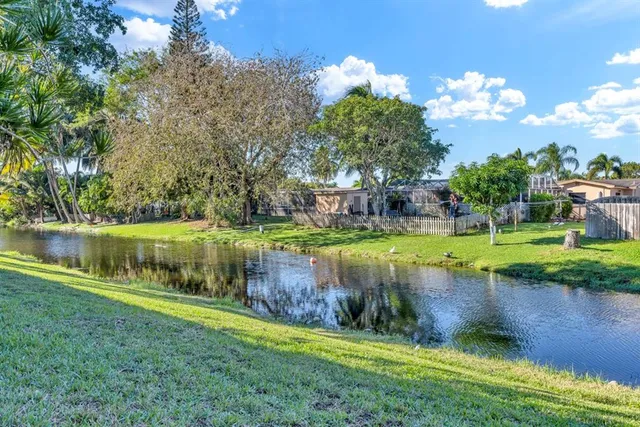 a view of a lake with a big yard