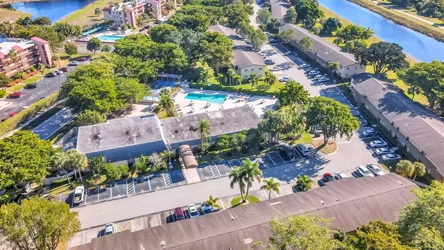 an aerial view of a house with a yard and garden