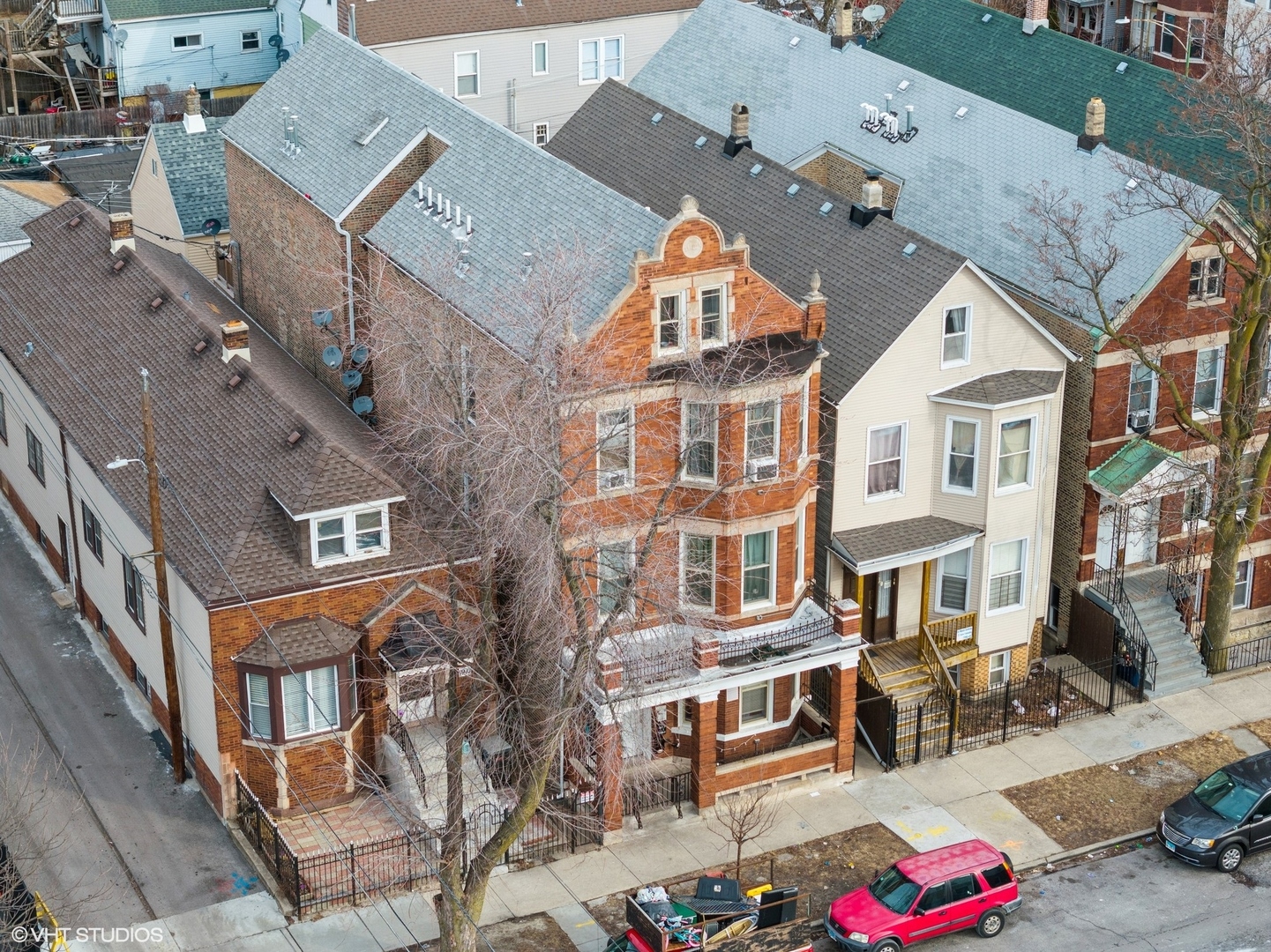 1908 West 48th Street Chicago, IL 60609 - Photo 26 of 36 an aerial view of a residential apartment building with a yard