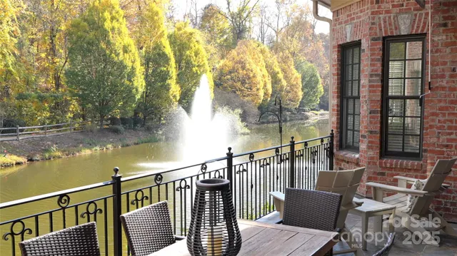 a view of a balcony with chair and wooden floor