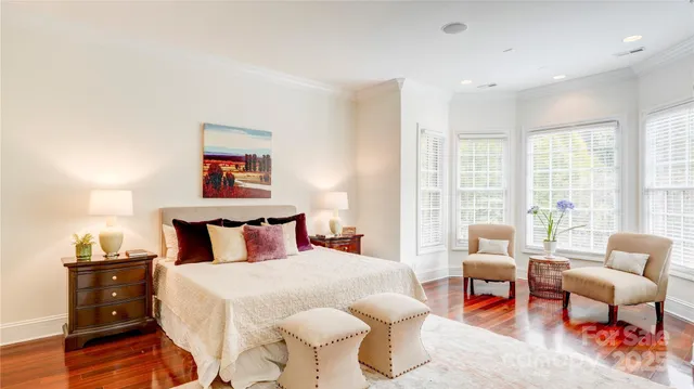 a bedroom with furniture and windows