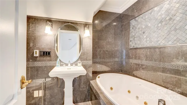 a bathroom with a sink and mirror