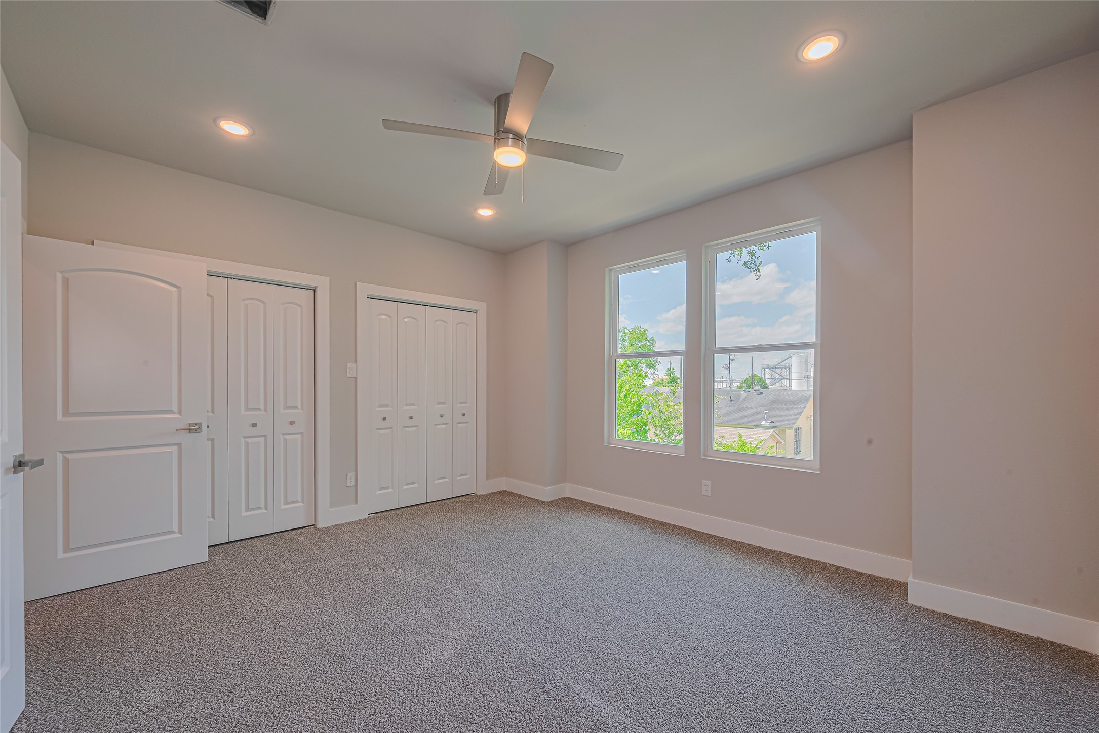 7207 Force Street Houston, TX 77020 - Photo 10 of 29 Bright and spacious bedroom with carpeted flooring.