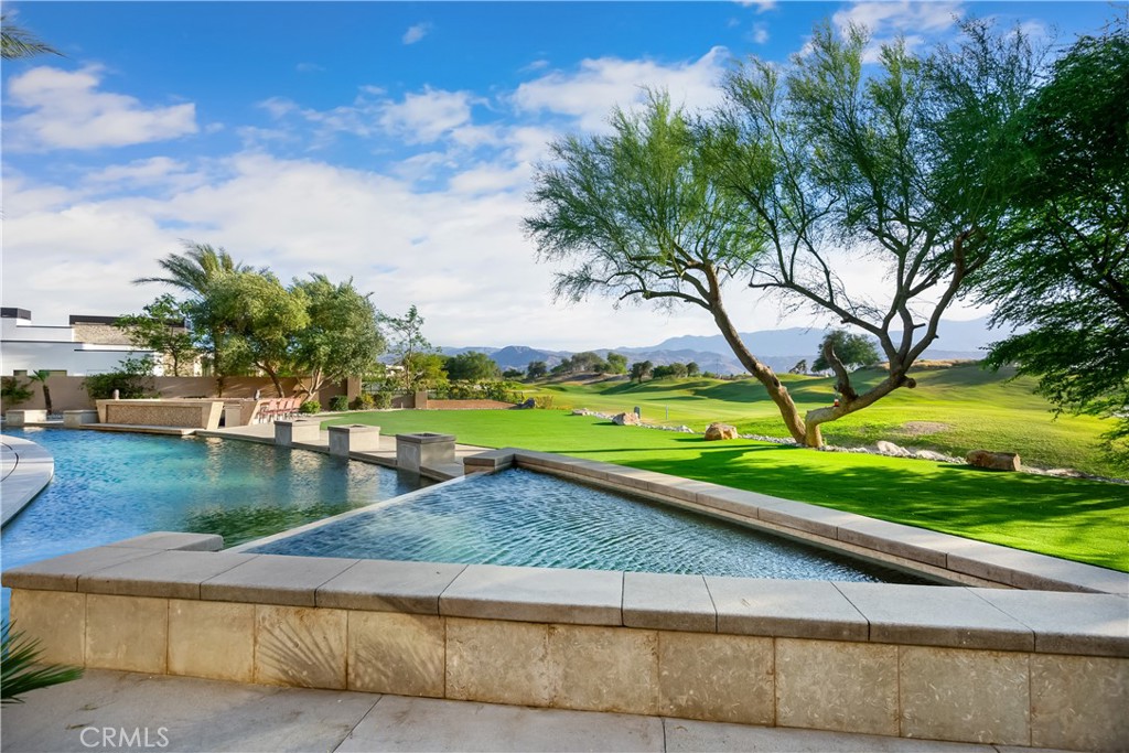 68 Royal St Georges Way Rancho Mirage, CA 92270 - Photo 16 of 75 a view of a yard with an outdoor space