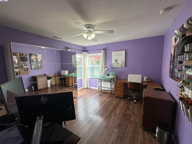 a view of a workspace with furniture and a livingroom