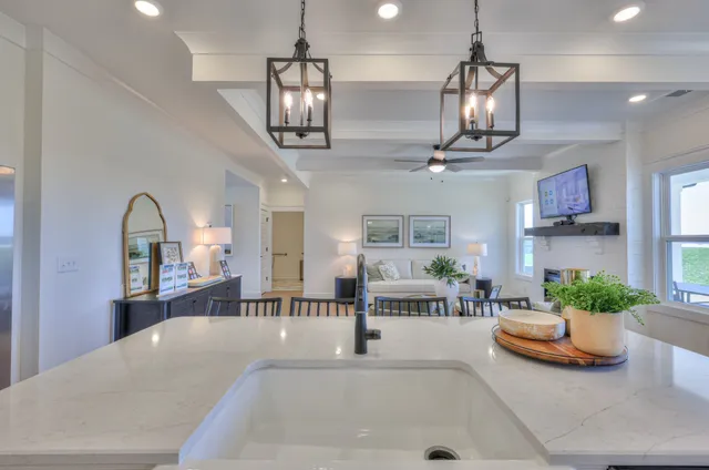 a lobby with furniture and a chandelier