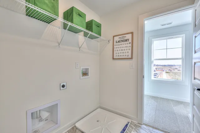 a bathroom with a toilet and a window