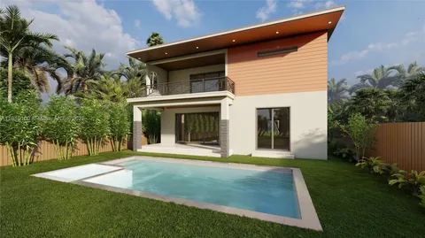 a view of a house with yard and garden