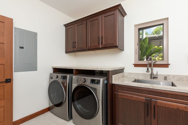 a bathroom with a granite countertop sink mirror and toilet