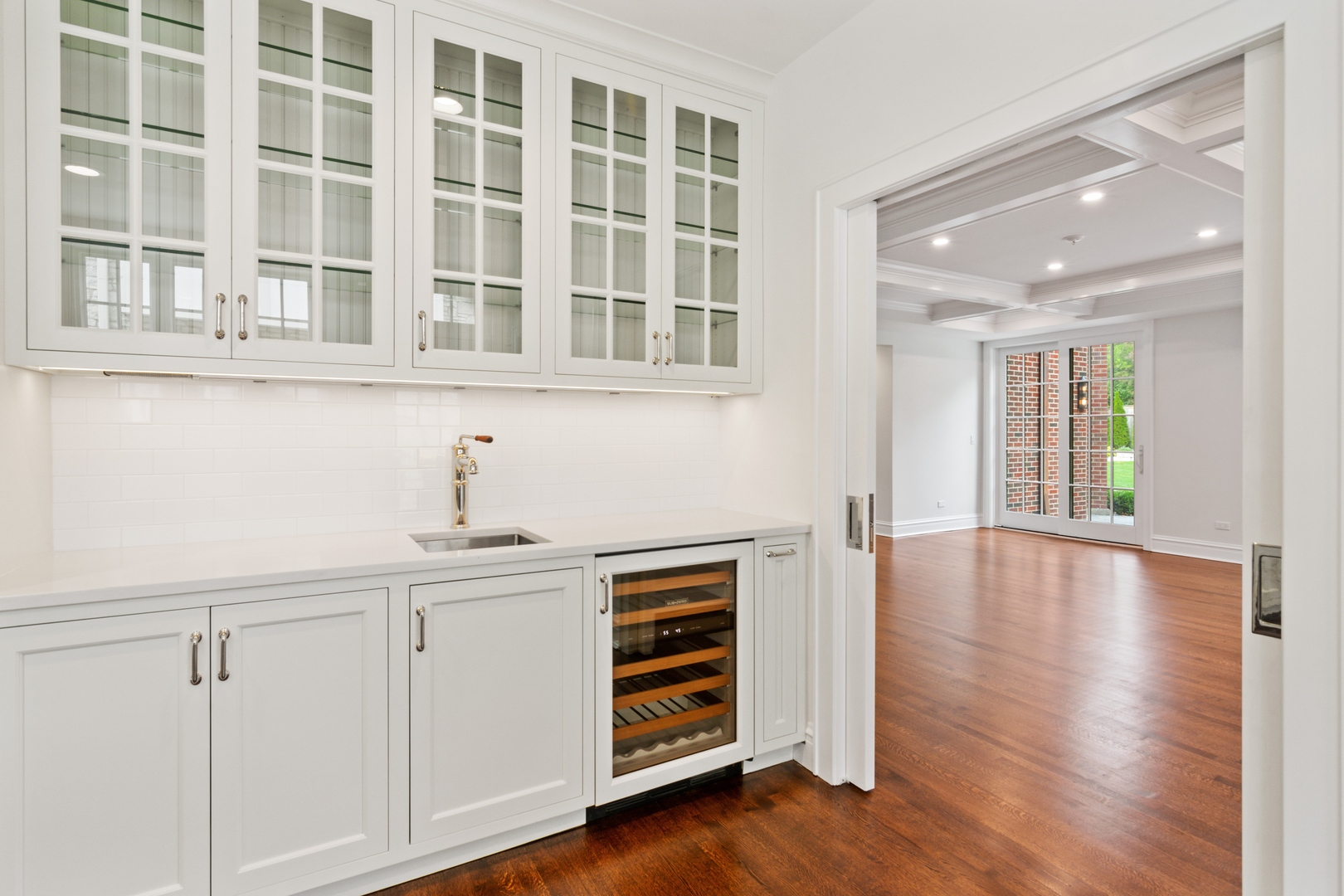 1045 Pine Street Winnetka, IL 60093 - Photo 13 of 38 a view of an empty room with window and wooden floor