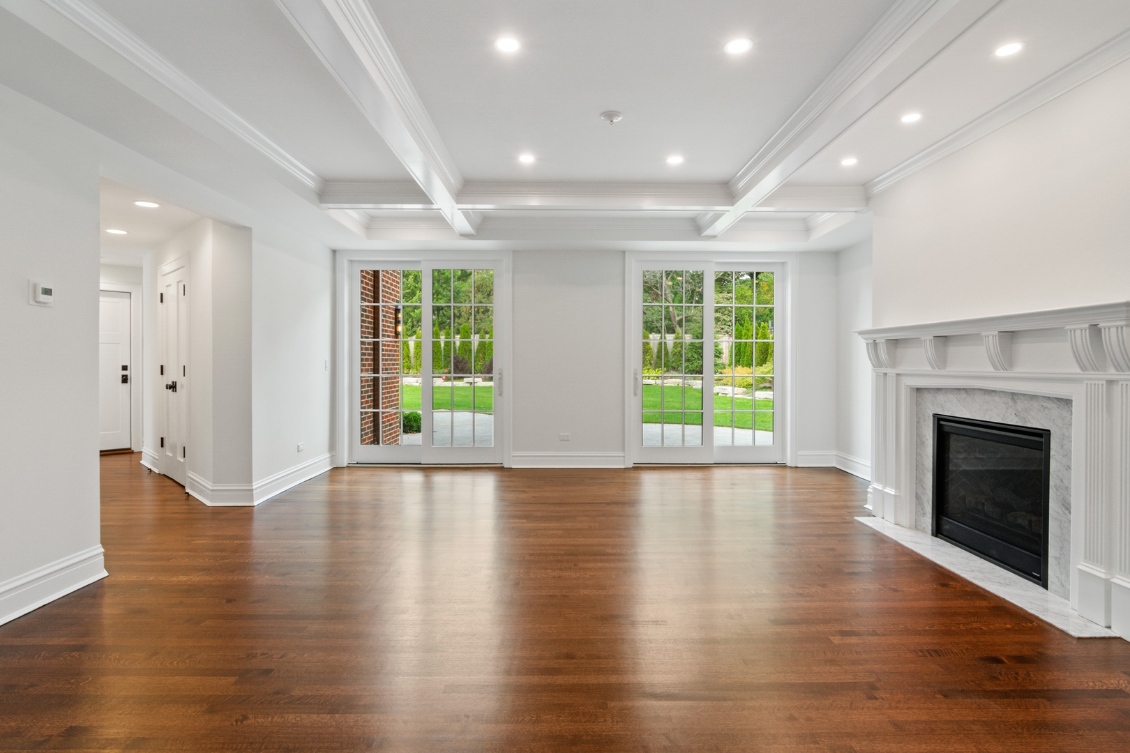 1045 Pine Street Winnetka, IL 60093 - Photo 15 of 38 a view of an empty room with wooden floor and a window