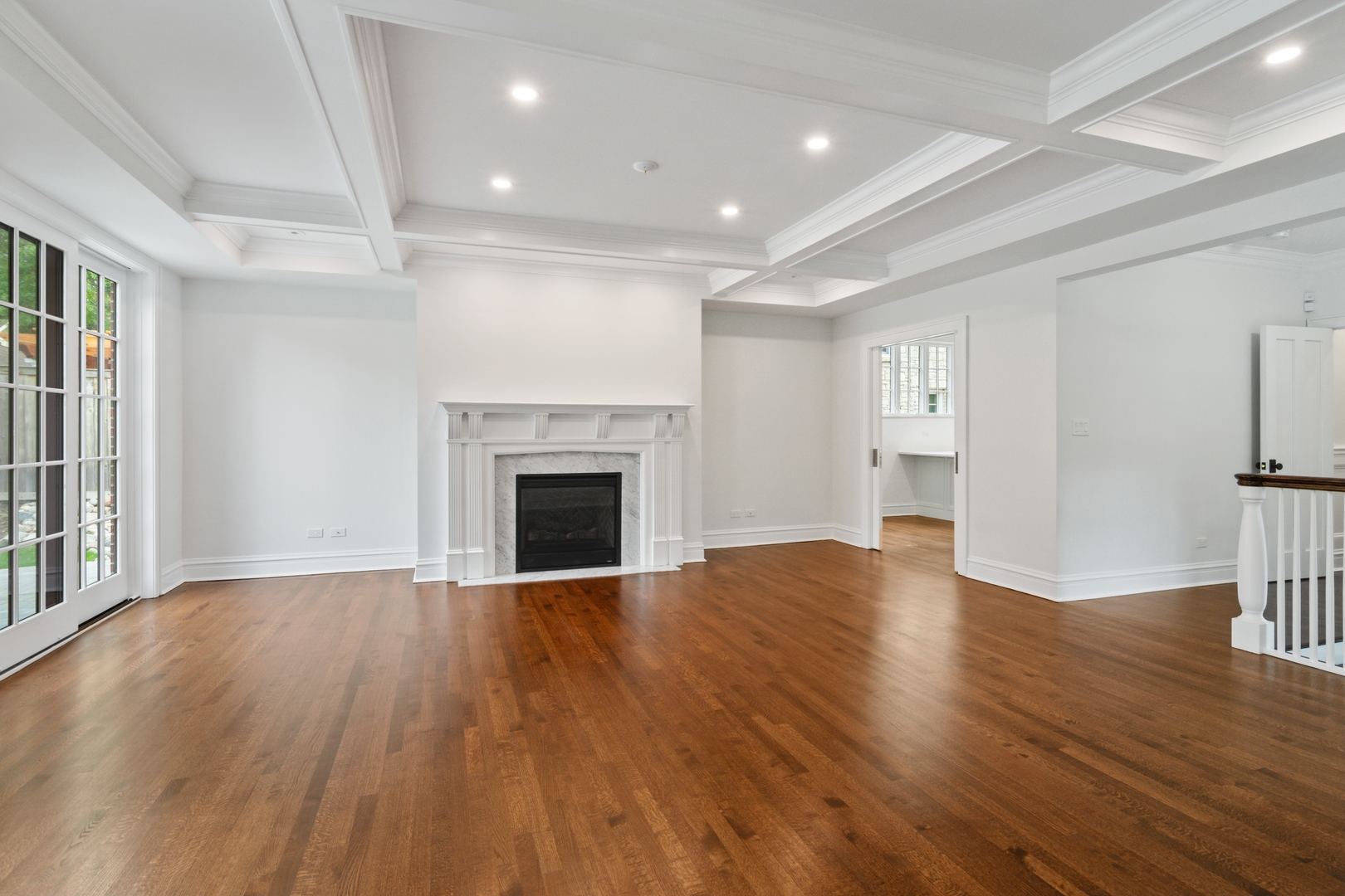 1045 Pine Street Winnetka, IL 60093 - Photo 16 of 38 a view of empty room with wooden floor and fireplace