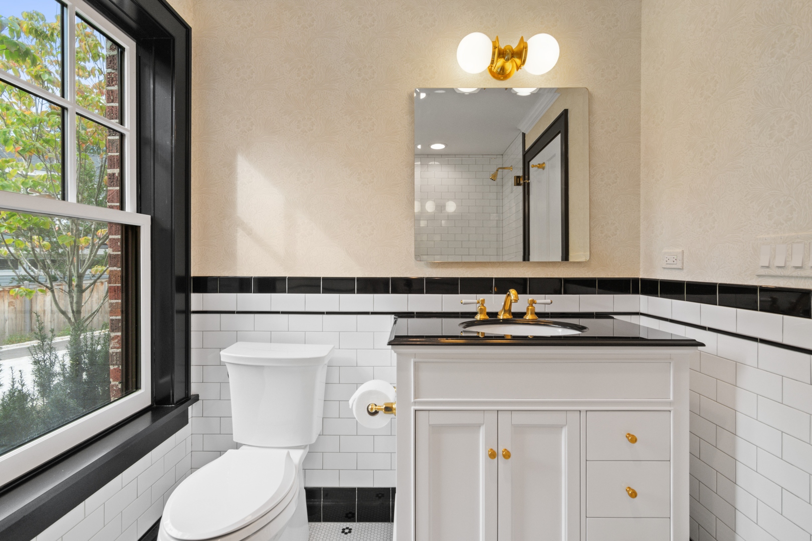 1045 Pine Street Winnetka, IL 60093 - Photo 17 of 38 a bathroom with a sink vanity mirror and toilet