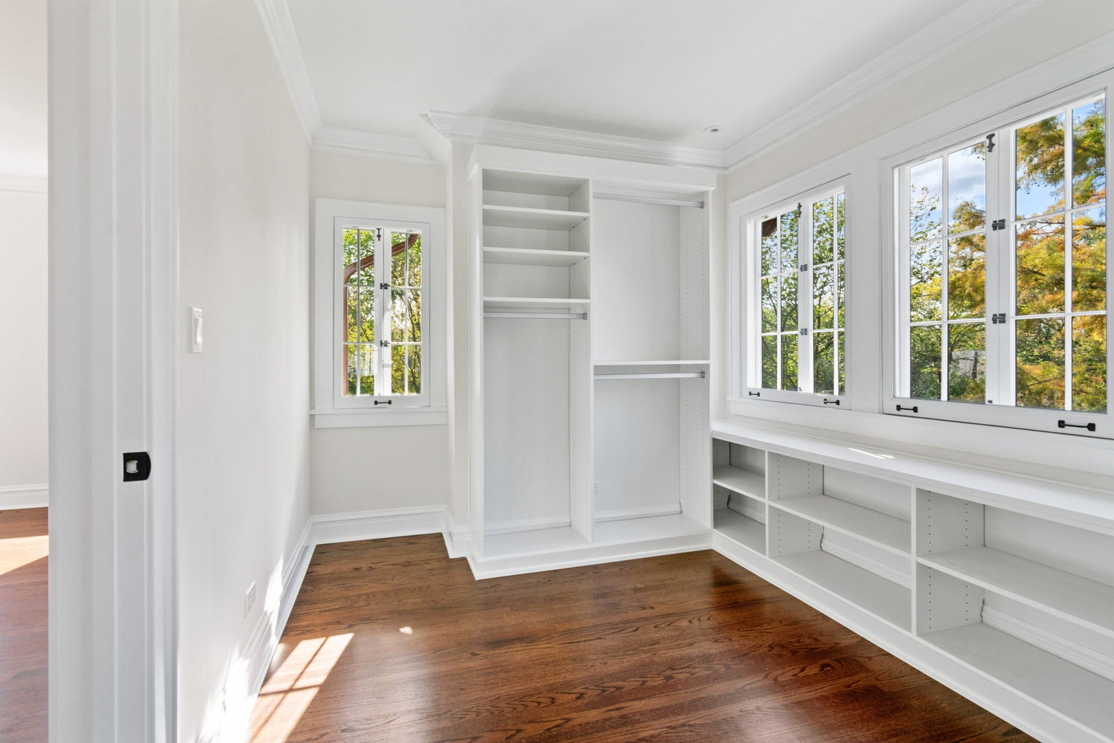 1045 Pine Street Winnetka, IL 60093 - Photo 24 of 38 a view of an empty room with wooden floor and a window