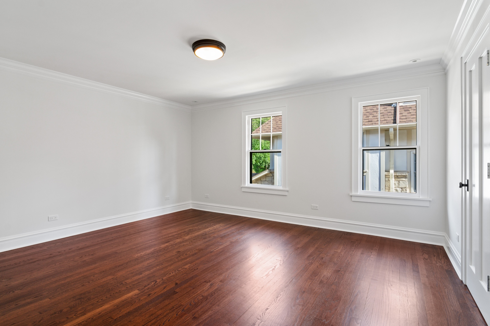 1045 Pine Street Winnetka, IL 60093 - Photo 25 of 38 an empty room with wooden floor and windows
