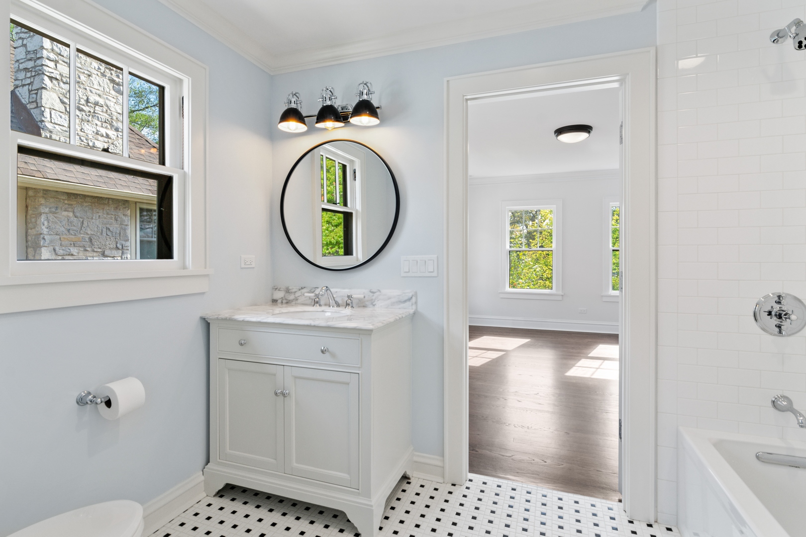 1045 Pine Street Winnetka, IL 60093 - Photo 26 of 38 a bathroom with a sink a toilet and a shower