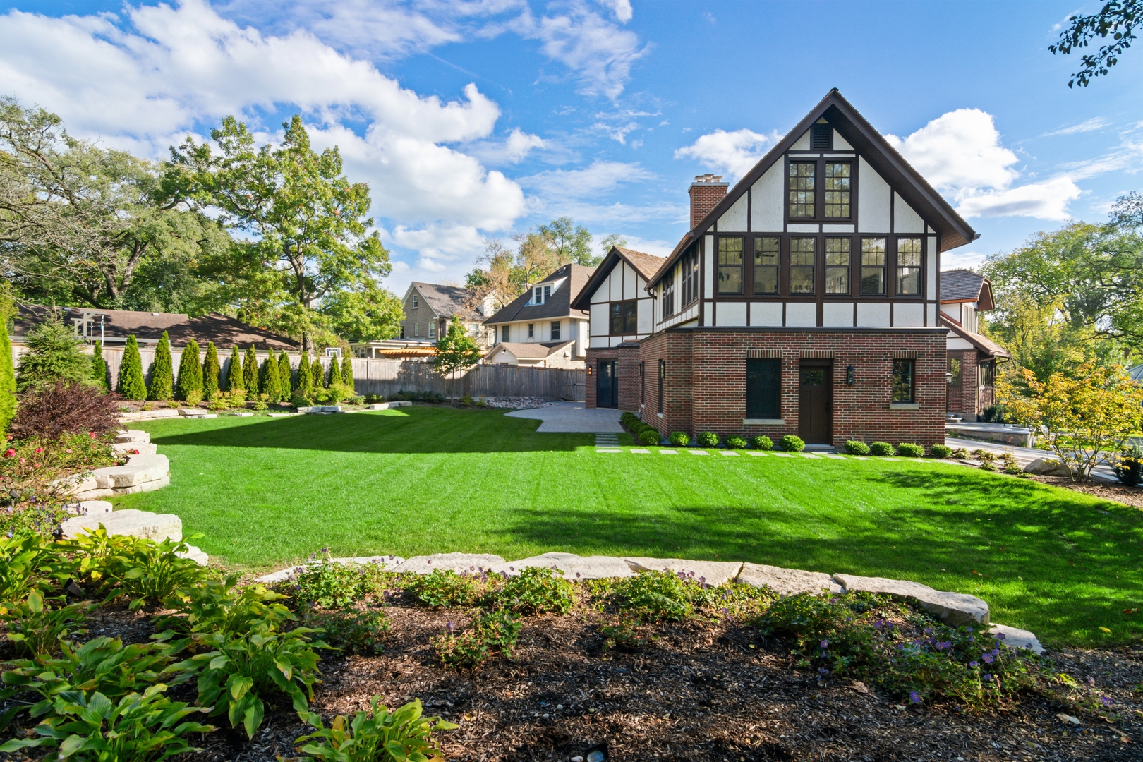 1045 Pine Street Winnetka, IL 60093 - Photo 34 of 38 a front view of a house with a yard