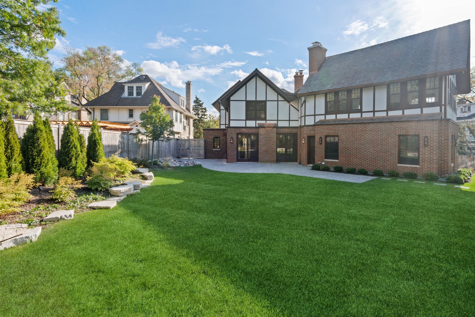 1045 Pine Street Winnetka, IL 60093 - Photo 35 of 38 a view of a house with a big yard and sitting area
