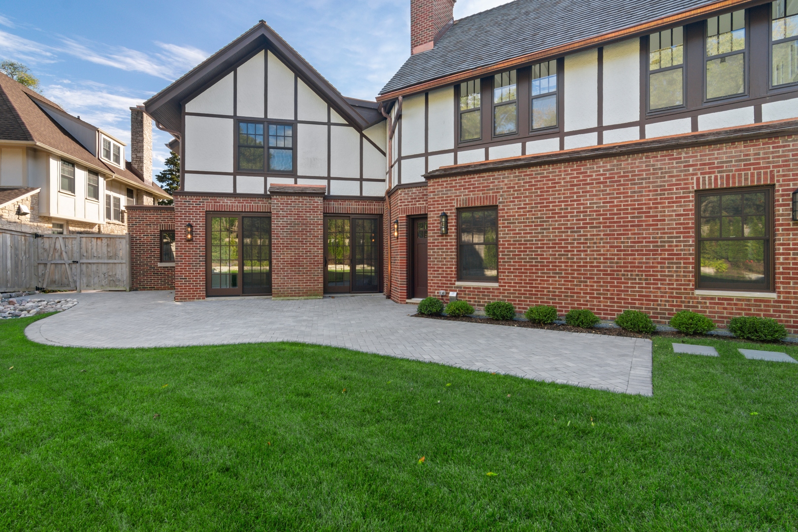 1045 Pine Street Winnetka, IL 60093 - Photo 38 of 38 a front view of a house with a yard and garage