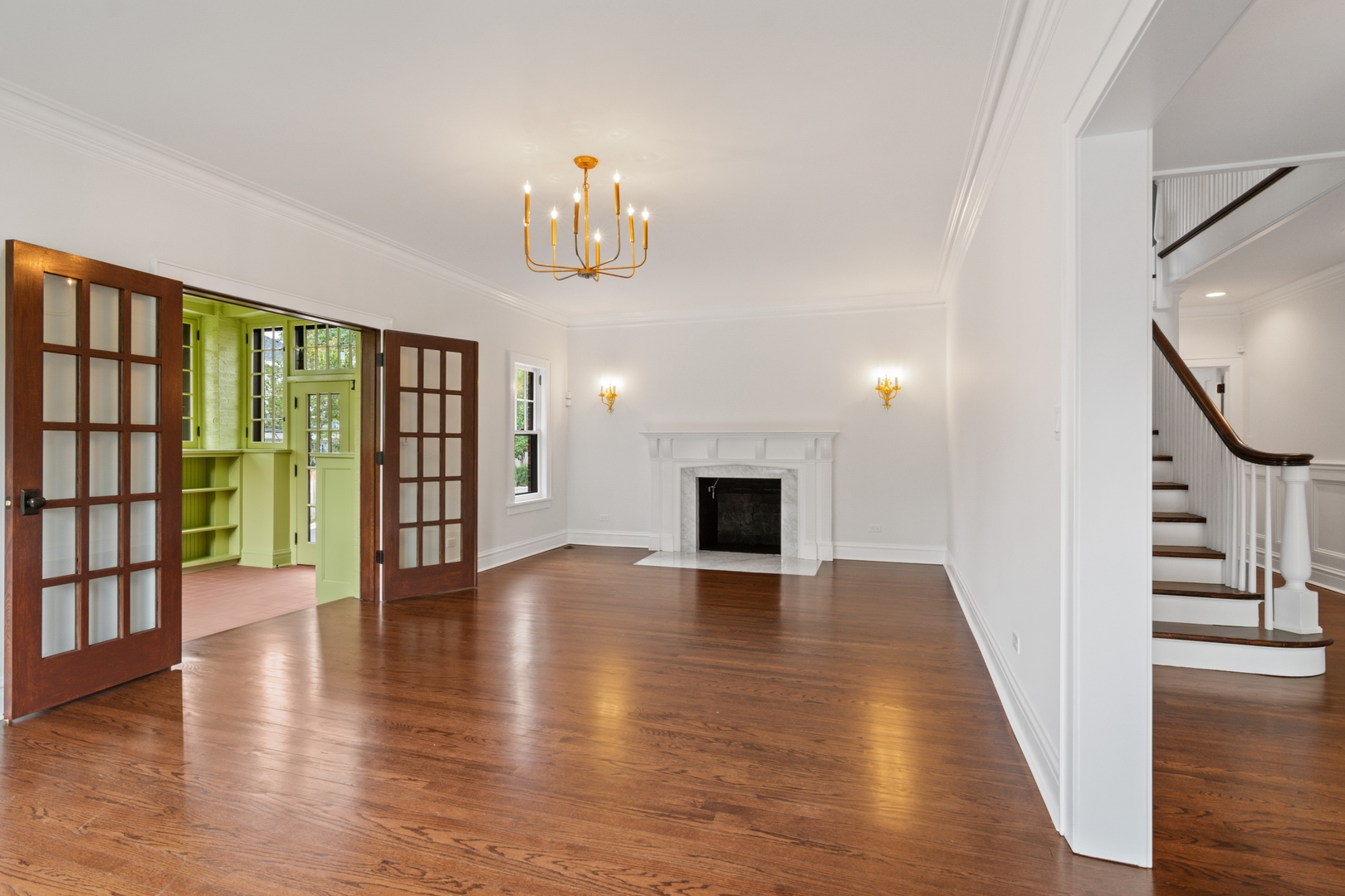 1045 Pine Street Winnetka, IL 60093 - Photo 6 of 38 a view of an empty room with wooden floor and a window