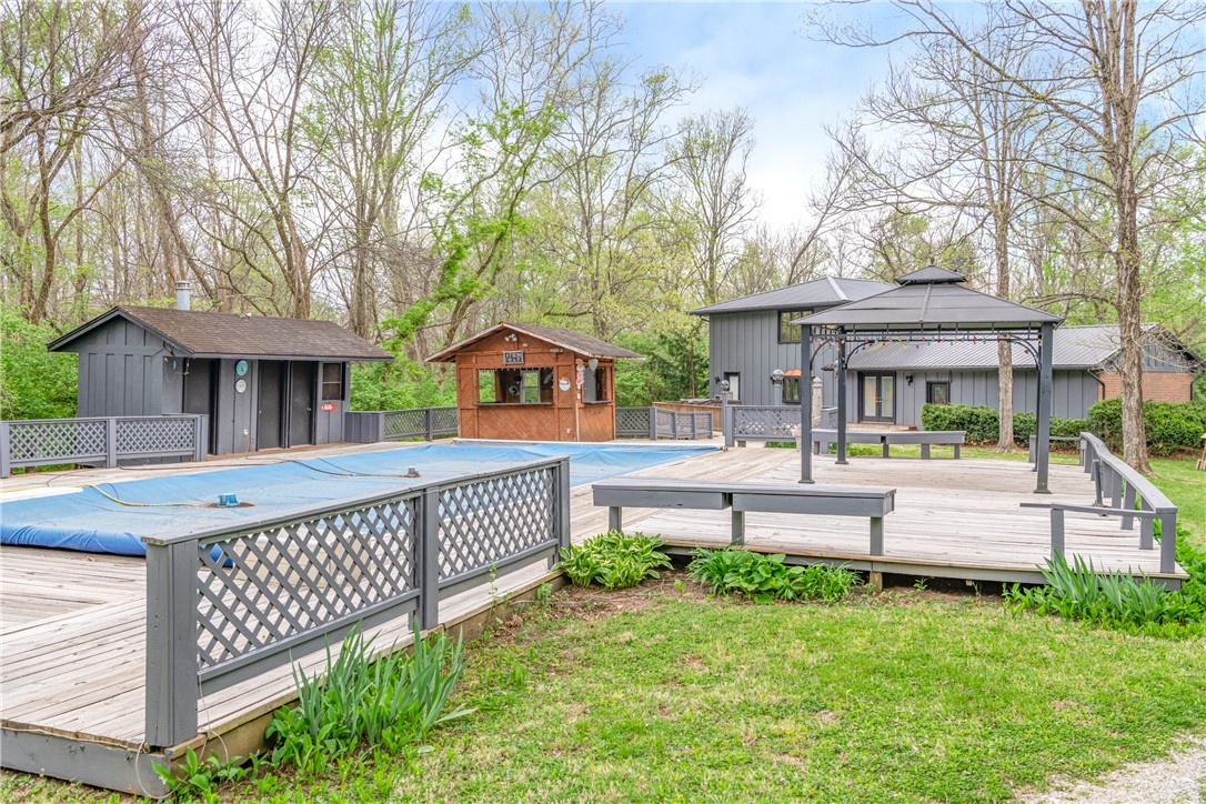 6750 Little Twin Road Germantown, OH 45327 - Photo 44 of 88 This property features an expansive outdoor area with a covered pool and versatile decking.