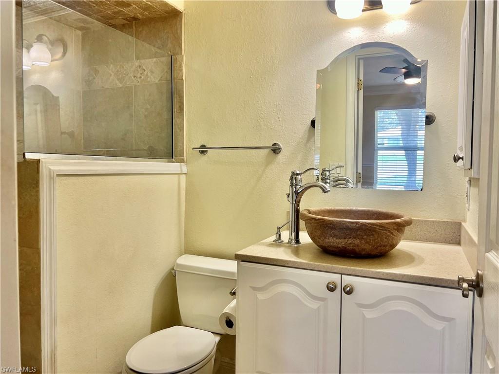 18581 Tampa Road Fort Myers, FL 33967 - Photo 18 of 25 Bathroom featuring vanity and toilet
