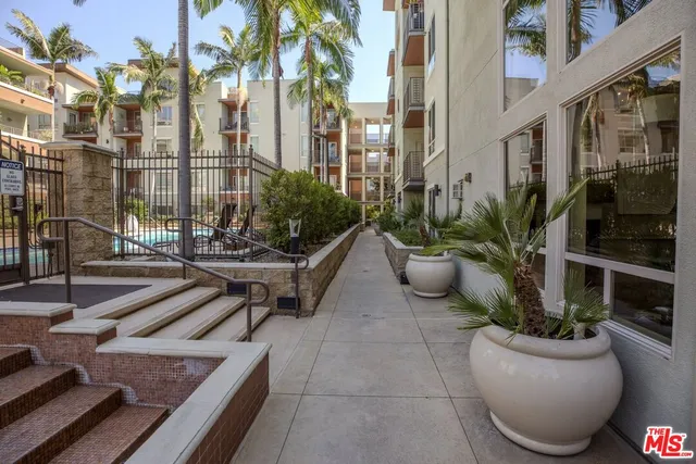 a lobby with furniture and rug