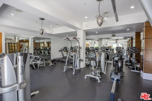 a room with a large mirror and glass door