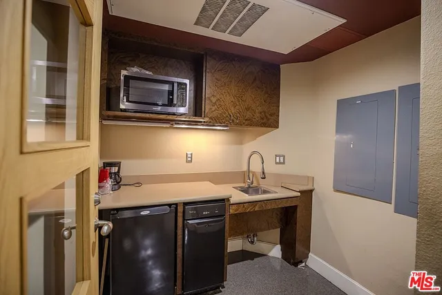 a view of a terrace with furniture and stove