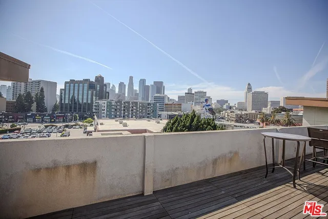 a view of a terrace with furniture and stove