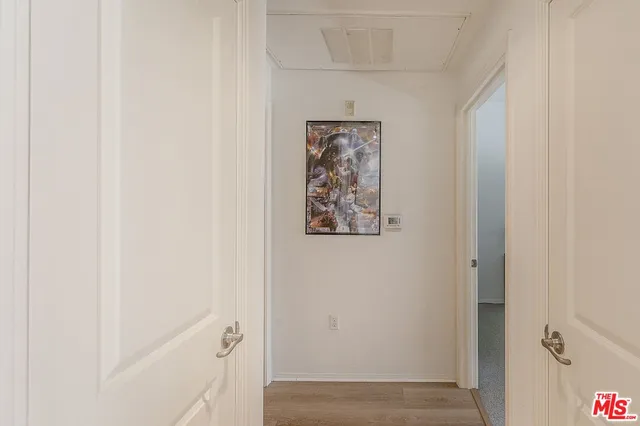 a bathroom with a granite countertop sink mirror and toilet