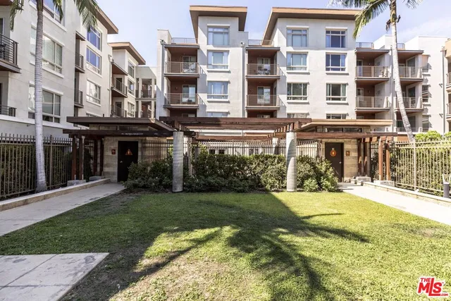 a view of a building with a yard