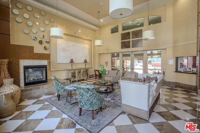 a living room with fireplace furniture and a fireplace