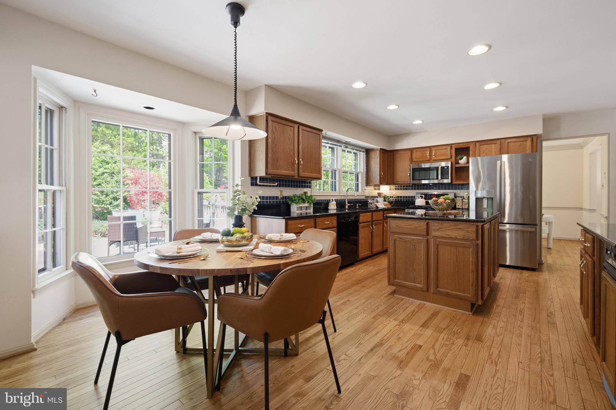 6830 Bluecurl Circle Springfield, VA 22152 - Photo 18 of 73 Seamless flow into a sunlit eat-in area