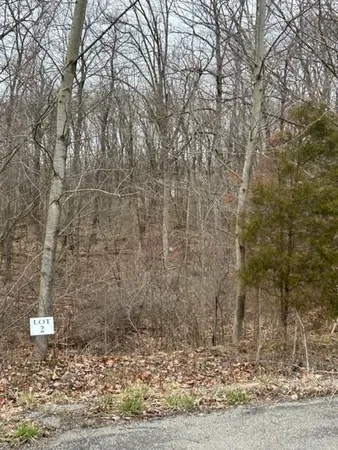 a view of a brick house with a yard