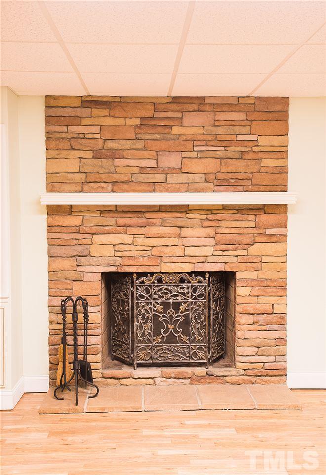 146 Younger Road Roxboro, NC 27573 - Photo 14 of 25 a close view of fireplace and wooden floor