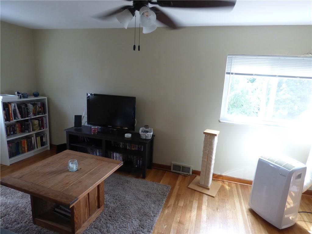 41 Charlton Street, Unit 2 Pittsburgh, PA 15204 - Photo 11 of 17 a living room with furniture and a flat screen tv