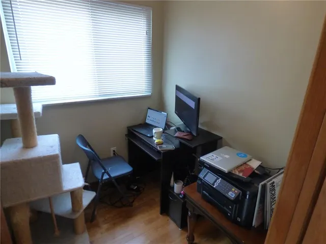 a view of a workspace with furniture