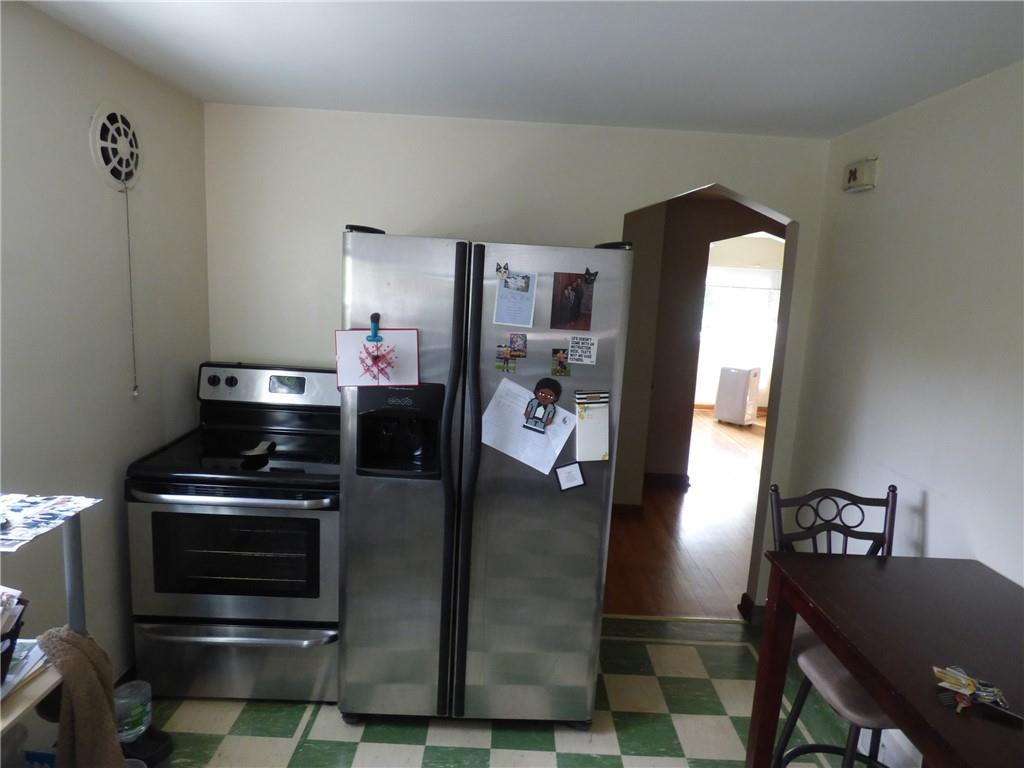 41 Charlton Street, Unit 2 Pittsburgh, PA 15204 - Photo 7 of 17 a kitchen with stainless steel appliances granite countertop a stove and a refrigerator