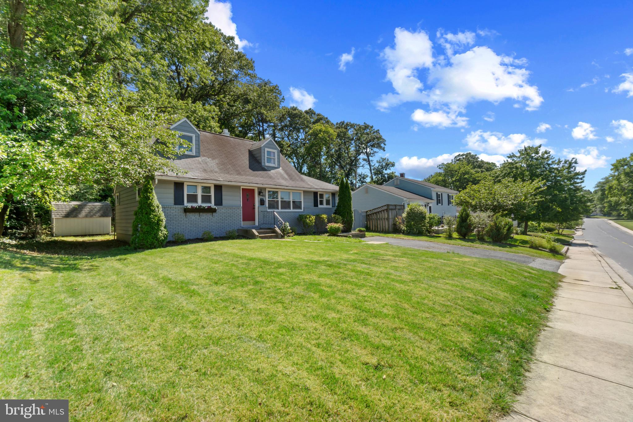 415 Baylor Road Glen Burnie, MD 21061 - Photo 2 of 29 a front view of a house with a yard