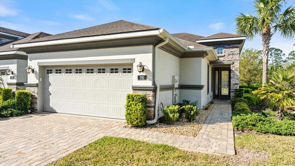 a front view of a house with a garage