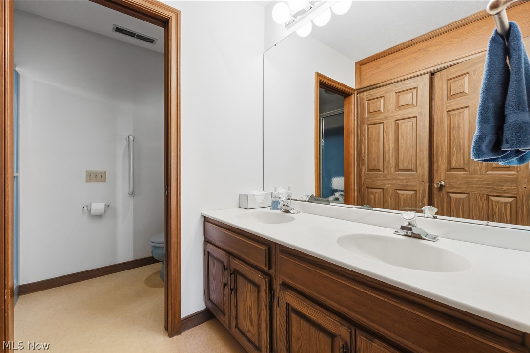 7014 River Styx Road Medina, OH 44256 - Photo 31 of 50 Bathroom with double vanity and toilet