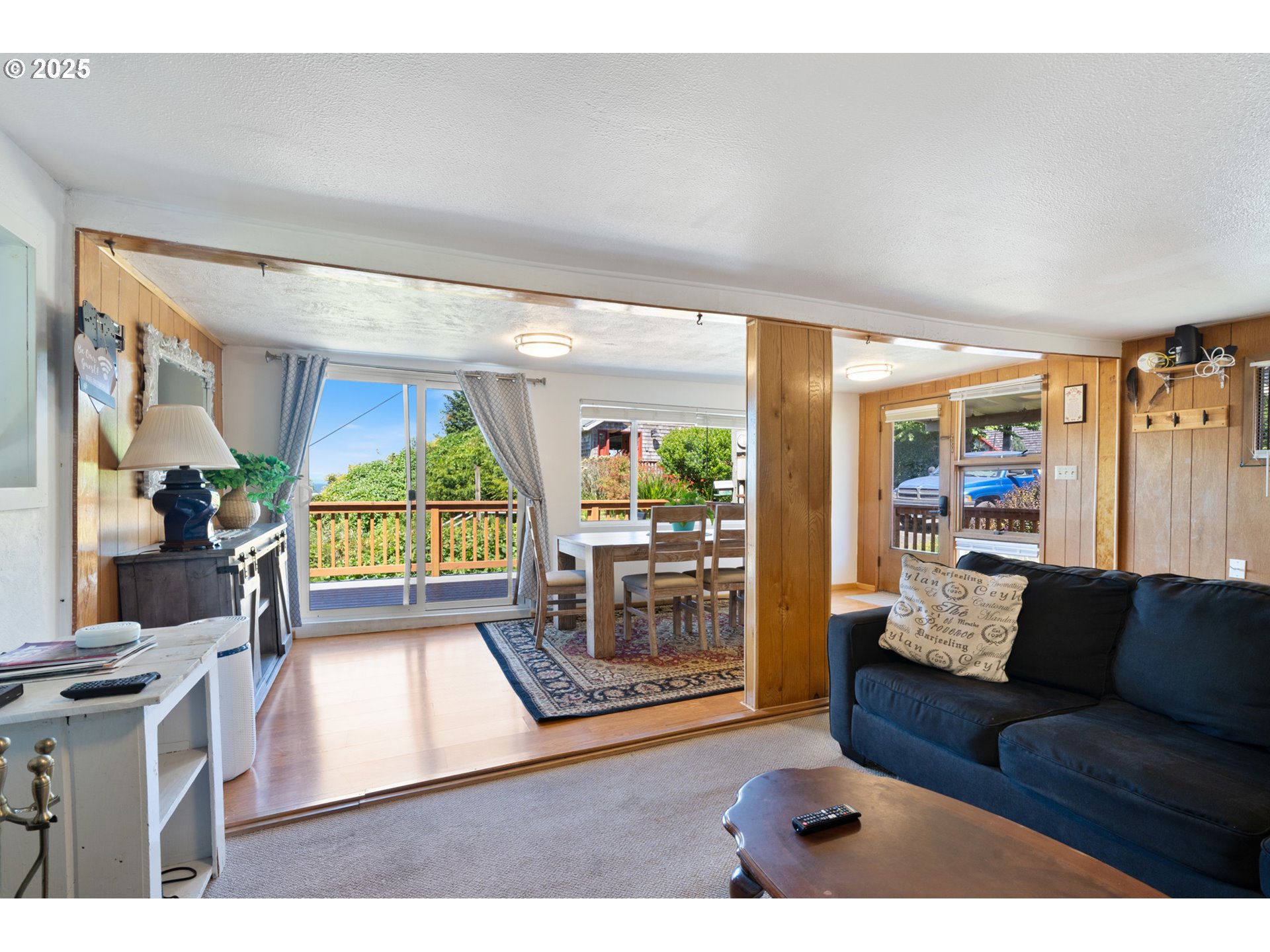 1195 3rd Street Netarts, OR 97141 - Photo 16 of 35 a living room with furniture and a large window