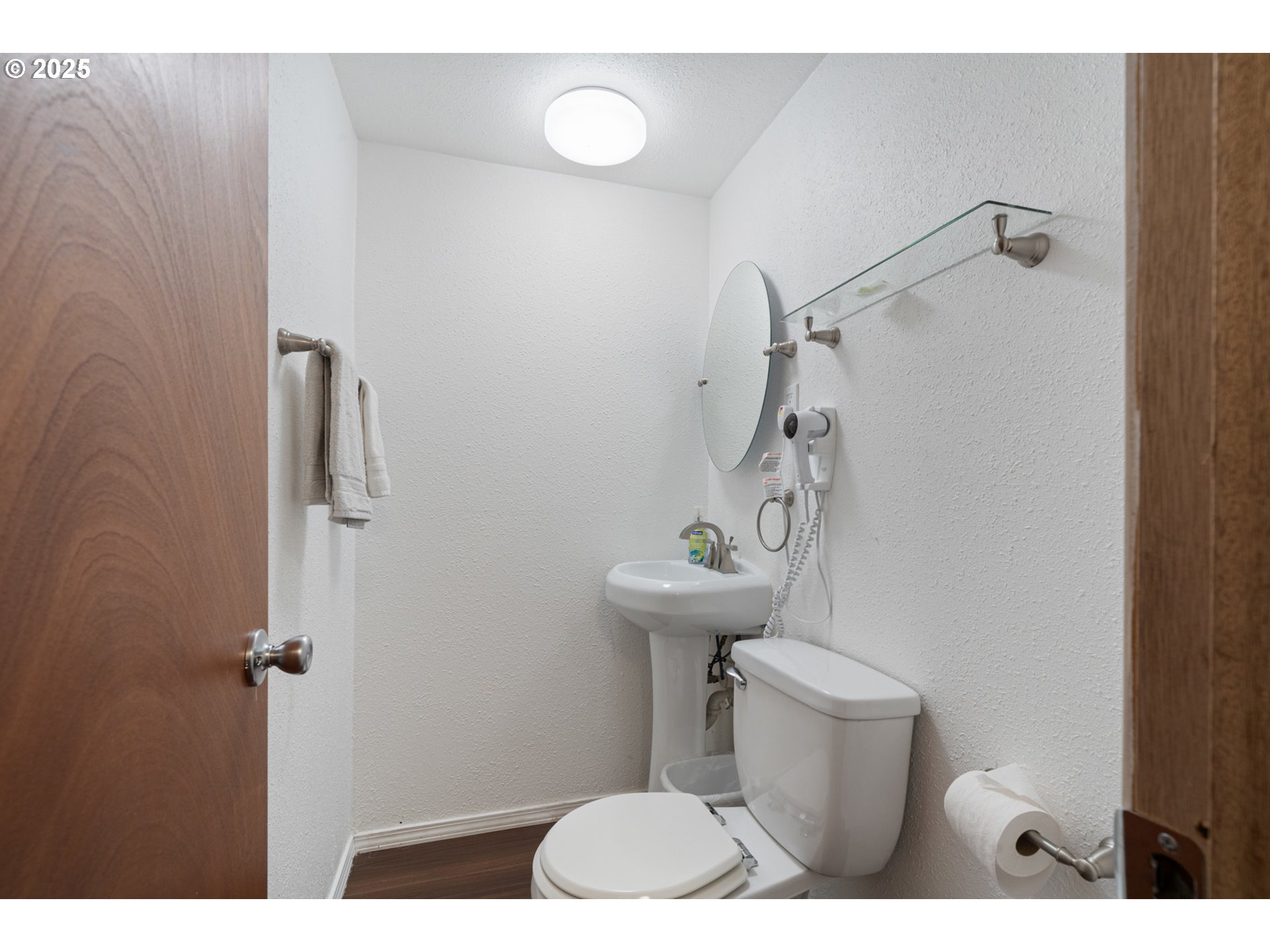 1195 3rd Street Netarts, OR 97141 - Photo 22 of 35 a bathroom with a toilet and a sink